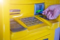 Man`s hand inserting a credit card in ATM , Hand inserting ATM plastic card into bank machine to withdraw money, finance money ban Royalty Free Stock Photo