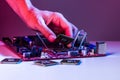 A man`s hand inserts a processor into the motherboard chipset Royalty Free Stock Photo