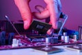 A man`s hand inserts a processor into the motherboard chipset Royalty Free Stock Photo