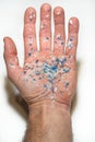 Hand with microplastics