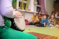 Man`s Hand with Musical Instrument African Djembe Meinl. Speech to a children`s audience