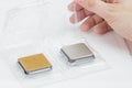 Man`s hand opening a box with a CPU.