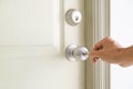 Hand opening the door with a key