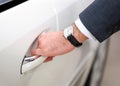 Mans hand opening luxury car door Royalty Free Stock Photo