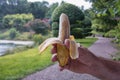 In the man`s hand a peeled banana Royalty Free Stock Photo