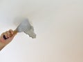 Man`s Hand Peeling a Ceiling Royalty Free Stock Photo