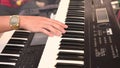 A man`s hand playing electone or keyboard