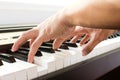 Man's hand playing piano. Royalty Free Stock Photo