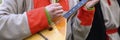 a man`s hand plays the balalaika. male musician with a traditional Russian musical instrument in winter Russian folk national clo