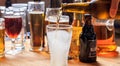 Pouring beer in an empty frosty glass of beer on a pub background Royalty Free Stock Photo