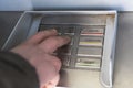 a man's hand presses a button in an ATM. Royalty Free Stock Photo