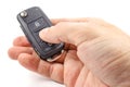 Man`s hand presses button on the ignition key Royalty Free Stock Photo