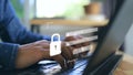 A man's hand presses a laptop keyboard and a screen appears to enter username and password Royalty Free Stock Photo