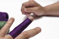 Man& x27;s hand and purple yarn isolated on a white background.Crochet.Copy space Royalty Free Stock Photo