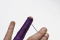 Man's hand and purple yarn isolated on a white background.Crochet.Copy space Royalty Free Stock Photo