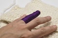 Man& x27;s hand and purple yarn isolated on a white background.Crochet.Copy space Royalty Free Stock Photo