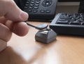 a man's hand puts a touch memory key on the reader to access the computer. Royalty Free Stock Photo