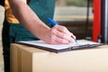 Man's hand signing delivery document Royalty Free Stock Photo