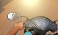 The man`s hand and the speedometer of the scooter are close-up Royalty Free Stock Photo