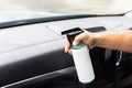 Man's Hand Spraying Cleaning Solution on Car Interior Royalty Free Stock Photo