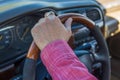 Man`s hand on the steering wheel inside of a car Royalty Free Stock Photo
