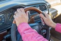 Man`s hand on the steering wheel inside of a car Royalty Free Stock Photo
