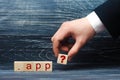 A man`s hand in a suit holds out a square with a question mark to the inscription of the App. A domain of high level Royalty Free Stock Photo