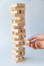 Hand and tower of wooden blocks Royalty Free Stock Photo