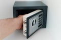 Man opening small safe