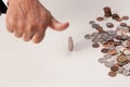 Man's hand tossing coin closeup thumb up Royalty Free Stock Photo