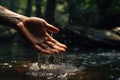 A man\'s hand touches seawater