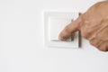 A man& x27;s hand turns on the light in the apartment Royalty Free Stock Photo