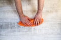 A man`s hand Using red rags wipe on white background or Royalty Free Stock Photo