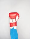 Man`s hand is wearing a red leather boxing glove Royalty Free Stock Photo