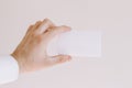 Man`s hand in white shirt showing a blank card Royalty Free Stock Photo
