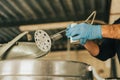 a man's hands collecting a milk sample for testing Royalty Free Stock Photo