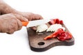 Man`s hands cutting pepper and onion with a ceramic knif Royalty Free Stock Photo