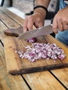 Man`s hands cutting red onion Royalty Free Stock Photo