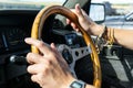 Man`s hands hold the steering wheel of a car. Royalty Free Stock Photo