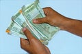 Man`s hands holding and counting new 500 and 200 rupees Indian currency Royalty Free Stock Photo