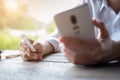 Man`s hands holding a credit card and using smart phone for online shopping, Online payment Royalty Free Stock Photo