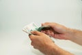 man`s hands are holding Russian money notes