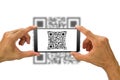 Man`s hands holding smartphone scanning QR code on white background Royalty Free Stock Photo