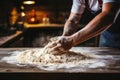 Man\'s hands knead dough, tradition in home cooking