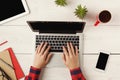 Man`s hands on laptop keyboard, top view Royalty Free Stock Photo