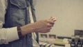 Man`s hands with parer blotters in a beauty store