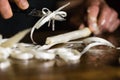 Man`s hands peeling fresh white asparagus for sterilization Royalty Free Stock Photo
