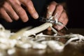 Man`s hands peeling fresh white asparagus for sterilization Royalty Free Stock Photo