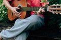 Man`s hands playing acoustic guitar have fun outdoor, close up Royalty Free Stock Photo