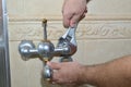 Removing old bathroom tap Royalty Free Stock Photo